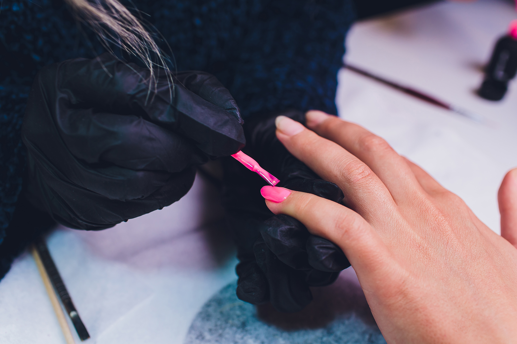 Close up of process france manicure at beauty salon.